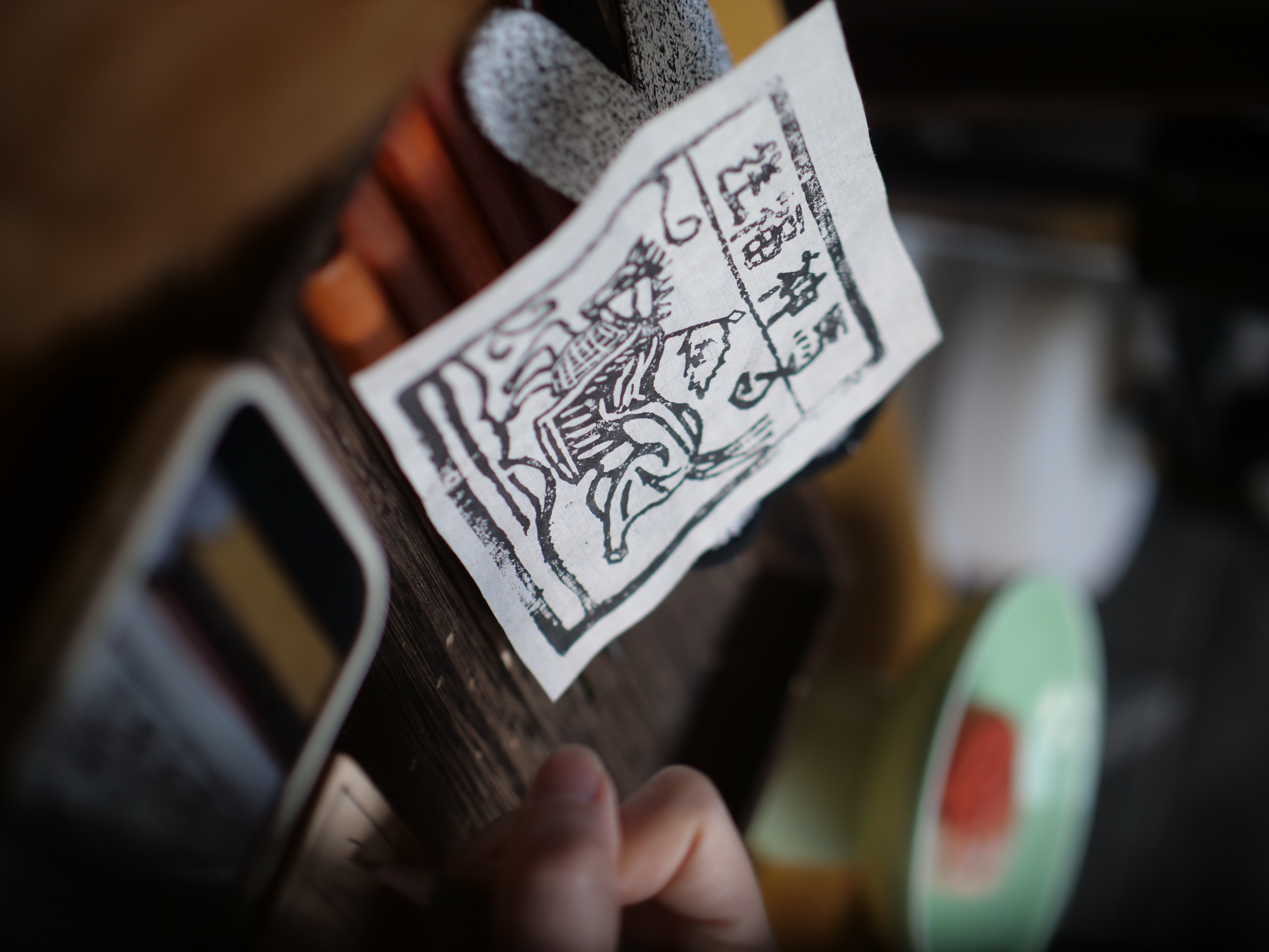 The first step in making a Jiama print is sketching the desired design onto a wooden block. /CGTN