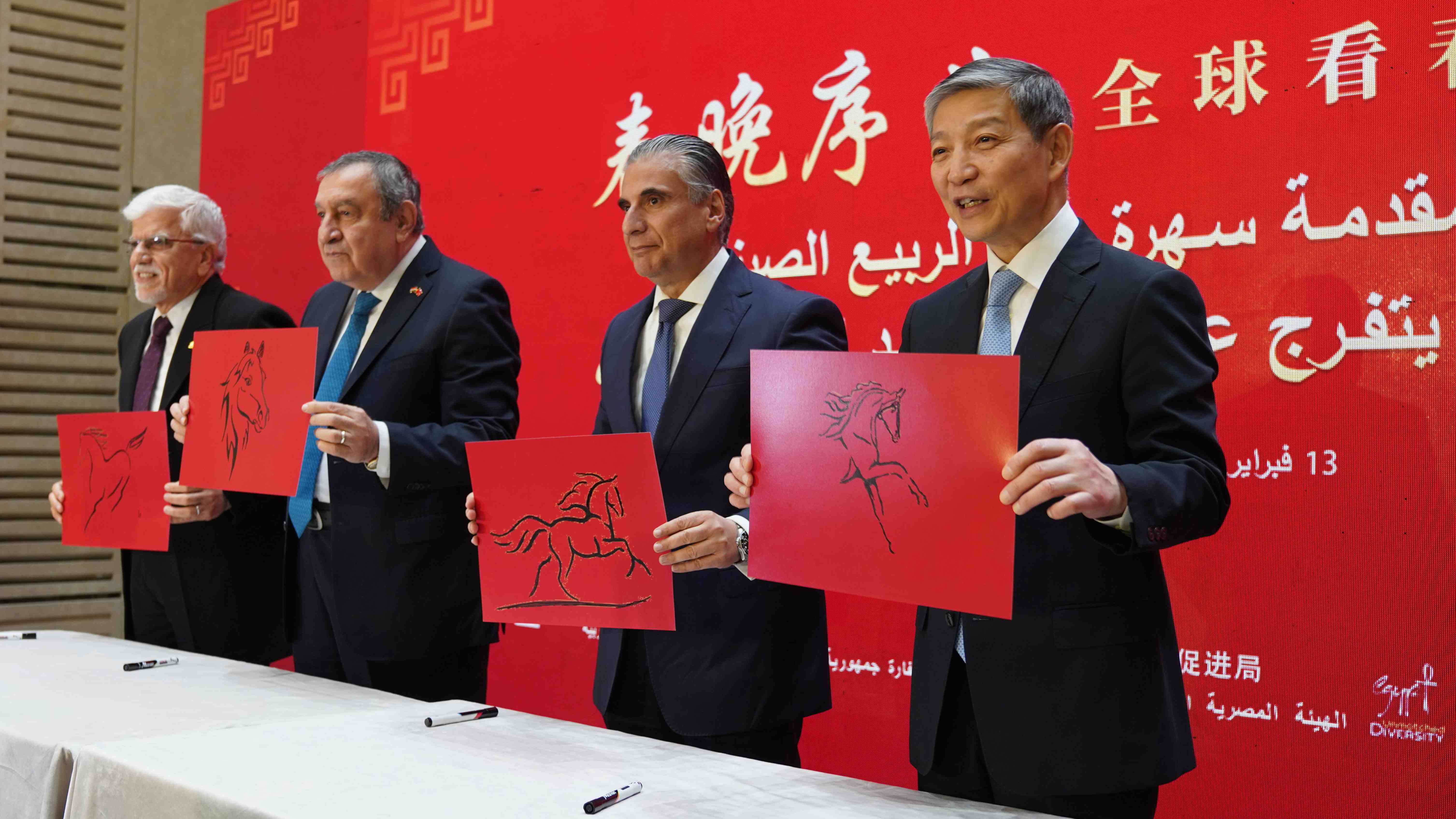 The guests with their paintings of horses. /CMG