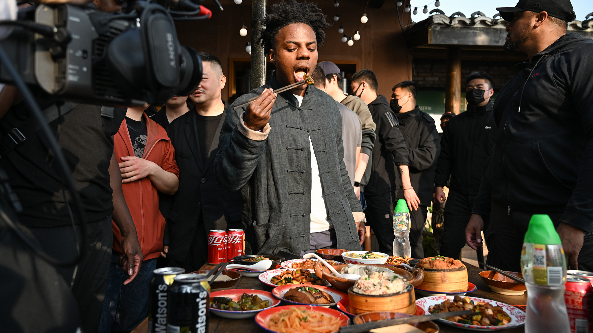 American YouTuber IShowSpeed, dressed in traditional Chinese clothing, tastes local Chinese dishes in Chongqing, southwest China, April 2, 2025. /CFP