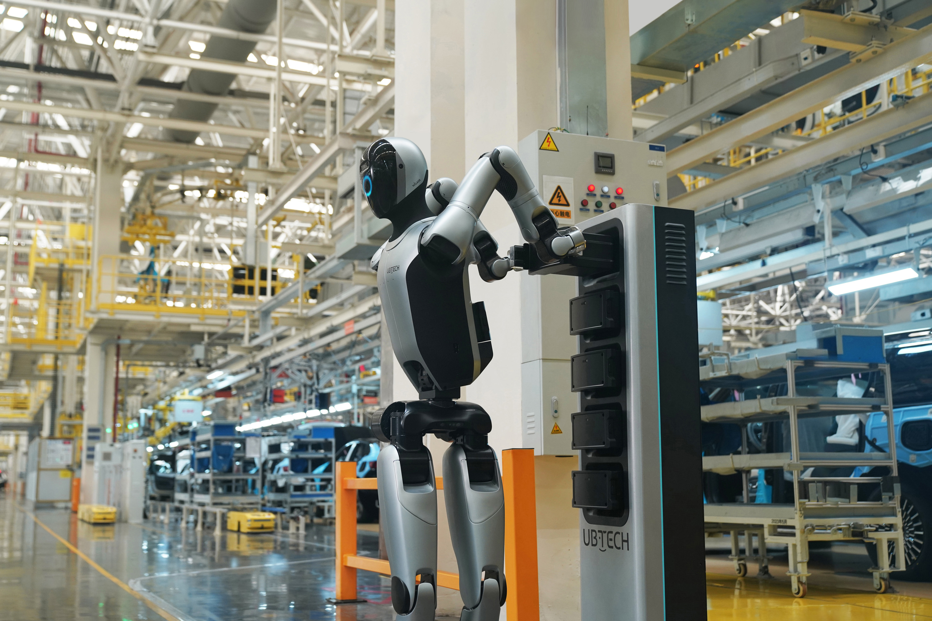 UBTECH's robot swaps its own batteries at a factory. /UBTECH