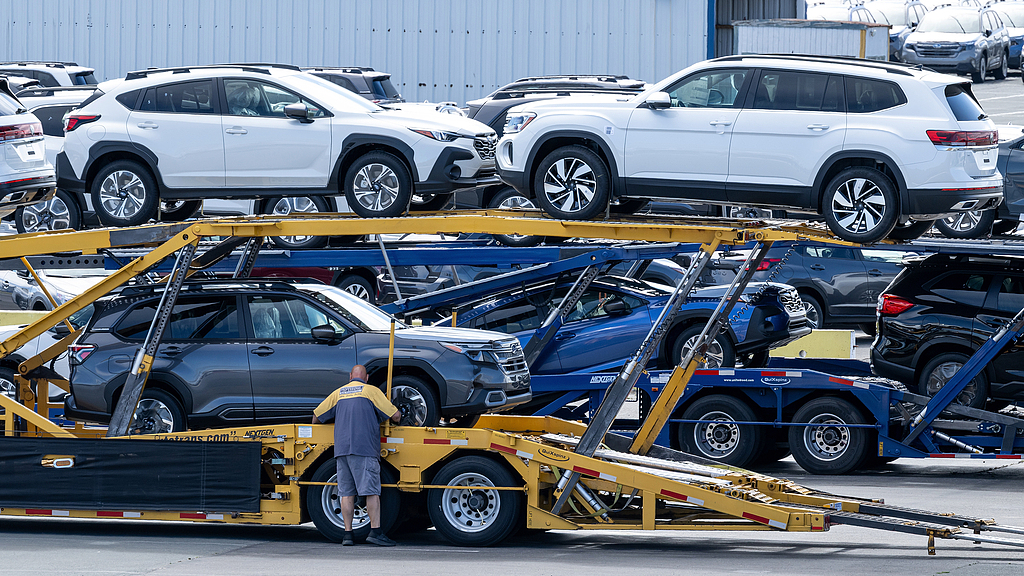  A worker loads new vehicles onto a truck in a storage lot in Richmond, California, US, on Sept. 8, 2025. /VCG