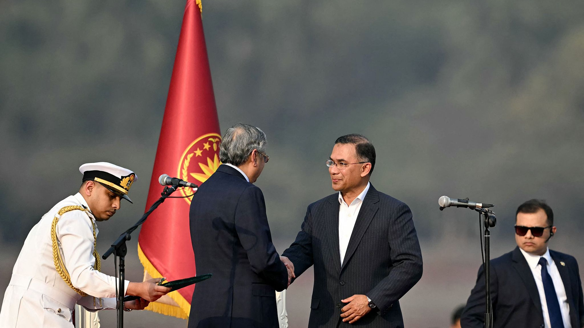 Bangladesh's newly sworn-in Prime Minister Tarique Rahman (2nd R) shakes hands with President Mohammed Shahabuddin during a swearing-in ceremony at the National Parliament building in Dhaka, Bangladesh, February 17, 2026. /VCG