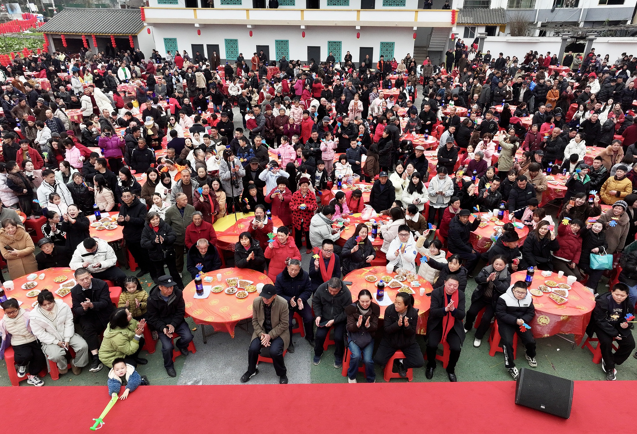 Local residents in Suining, Sichuan, gather to attend a traditional 