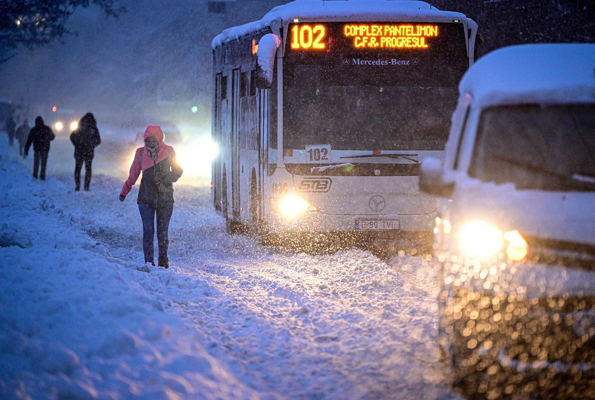People walk on a snow-covered street in Bucharest, Romania, February 18, 2026. /VCG