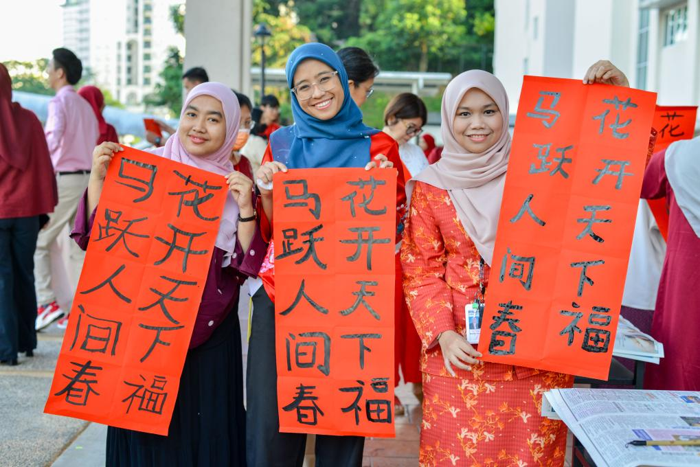Teachers and students display Spring Festival couplets at a school in Kuala Lumpur, Malaysia, February 7, 2026. /Xinhua