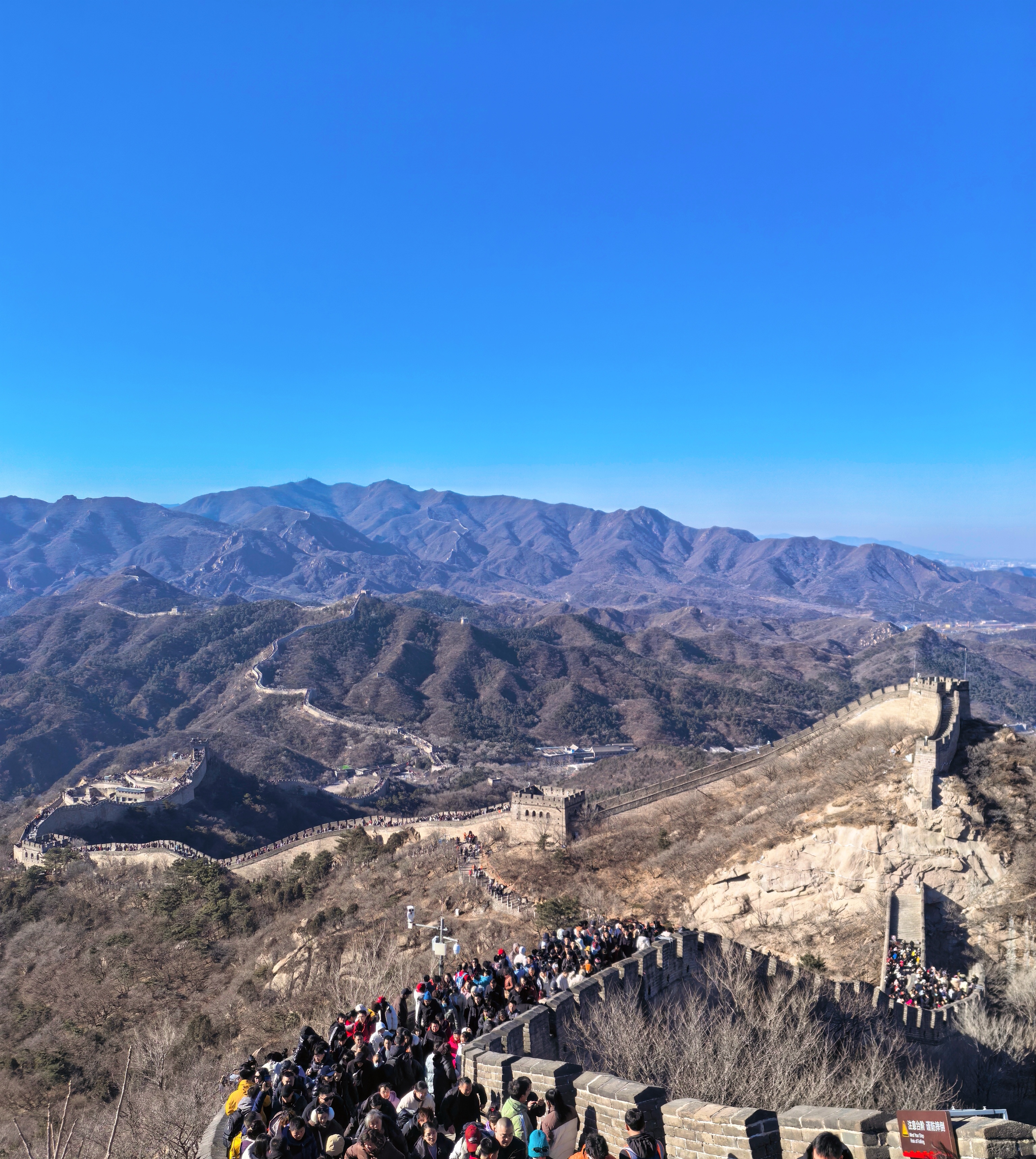 Visitors climb the Badaling Great Wall in Beijing on February 18, 2026. /CGTN