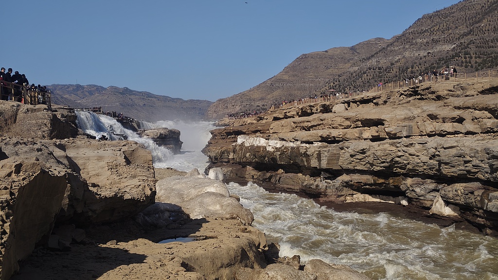 The Hukou Waterfall in Yan'an, Shaanxi Province, attracts many tourists, February 20, 2026. /VCG