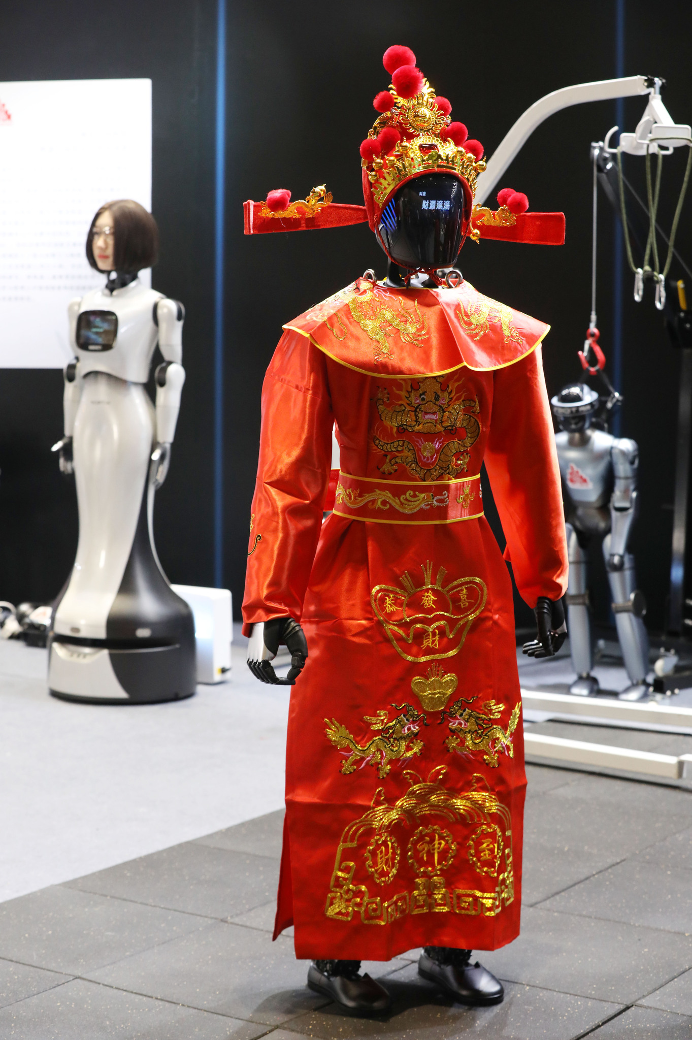 A robot Chinese God of Wealth is pictured at the 2026 Dadu Spring Festival Temple Fair in Beijing on February 20, 2026. /VCG