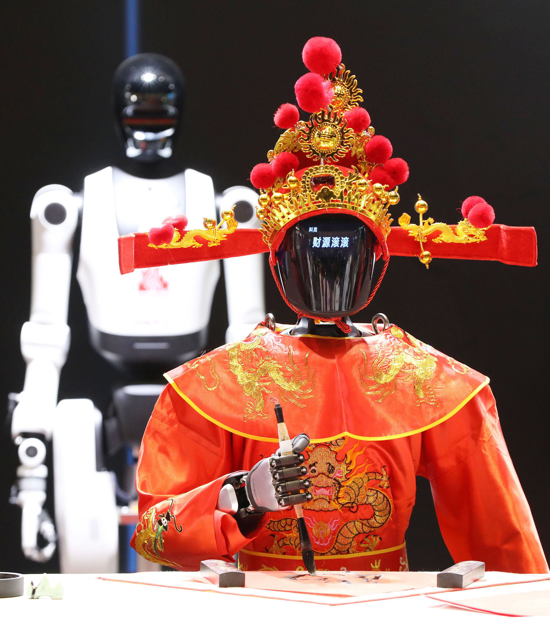 A robot Chinese God of Wealth is pictured at the 2026 Dadu Spring Festival Temple Fair in Beijing on February 20, 2026. /VCG