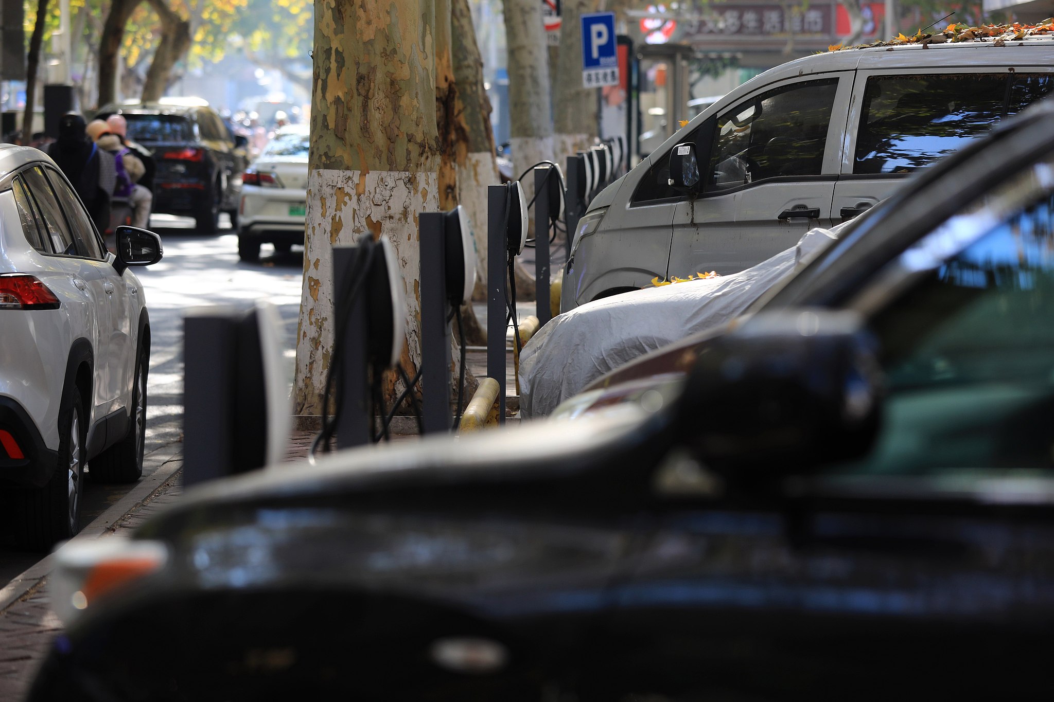 New Energy Vehicles (NEVs) power up at a charging station on Renmin Road in Huai'an, east China's Jiangsu Province, January 21, 2026. /CFP