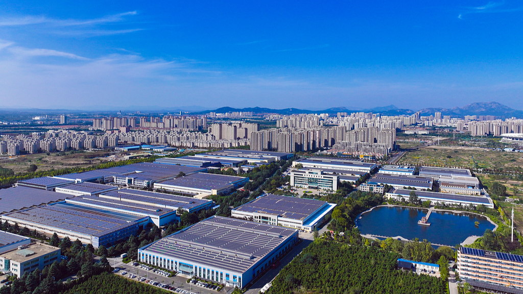 Solar panels neatly arranged on the rooftops of factory buildings in an industrial park, Rizhao City, east China's Shandong Province, October 22, 2025. /VCG