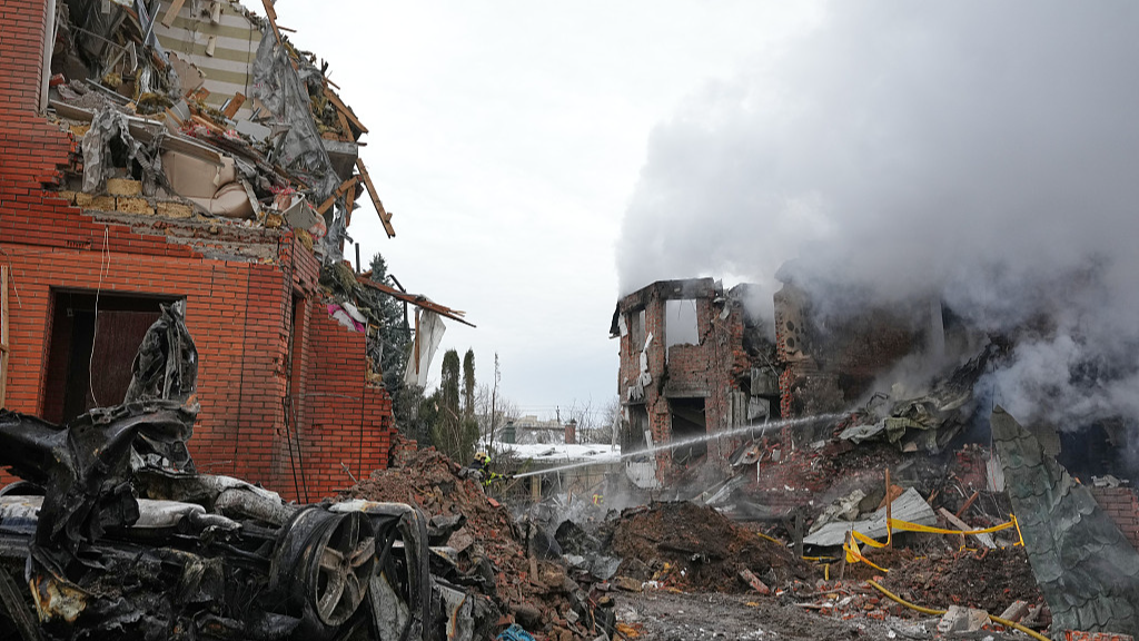 Emergency services personnel work to extinguish a fire following a Russian attack in Kyiv, Ukraine, February 22, 2026. /VCG