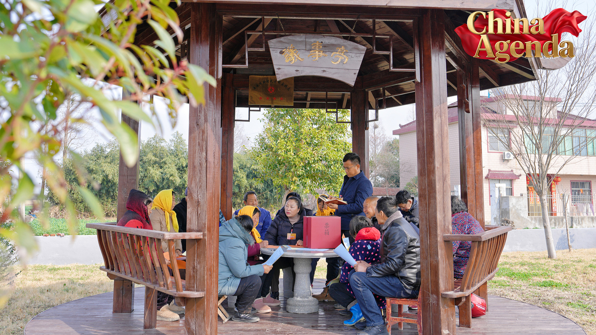 A deputy to the township-level people's congress solicits opinions and suggestions from residents at a 