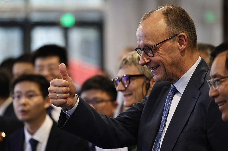German Chancellor Friedrich Merz gestures a thumbs up as he visits the Unitree Robotics headquarters on the last day of his official visit to China, in Hangzhou, east China's Zhejiang Province, February 26, 2026. /VCG