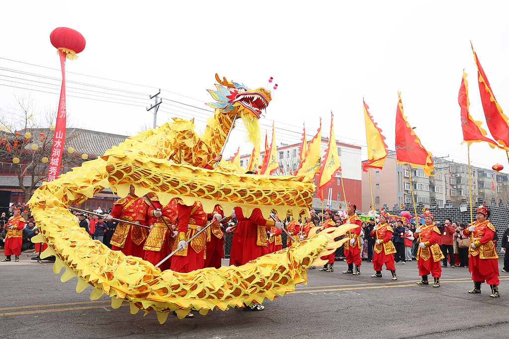 Dragon and lion dances are performed during the Spring Festival Folk Art Parade in Lingshou County, Shijiazhuang City, Hebei Province, February 26, 2026. /CFP
