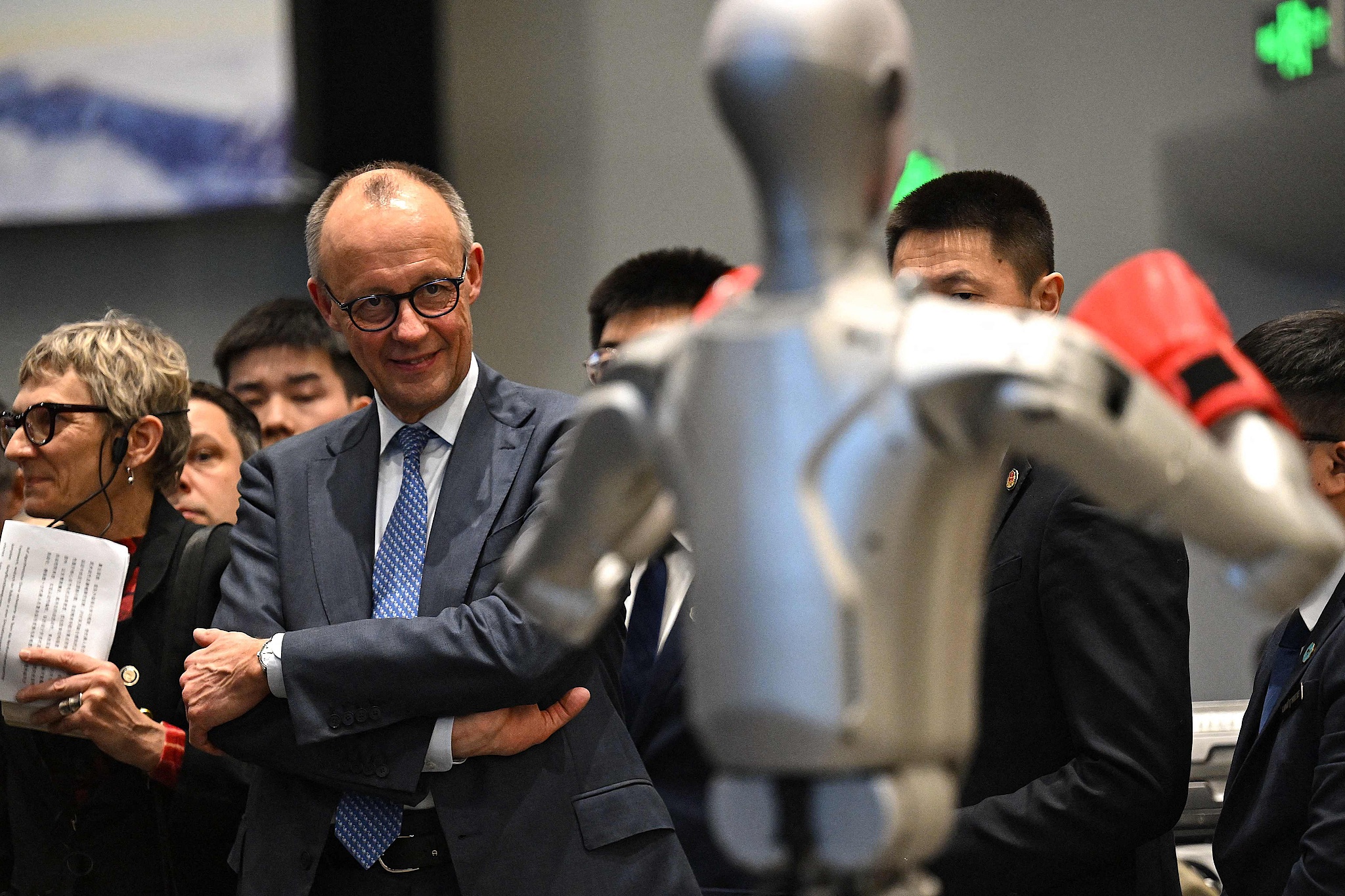 Germany's Chancellor Friedrich Merz visits a showroom of Unitree Robotics products in Hangzhou, in eastern China's Zhejiang Province on February 26, 2026. /VCG
