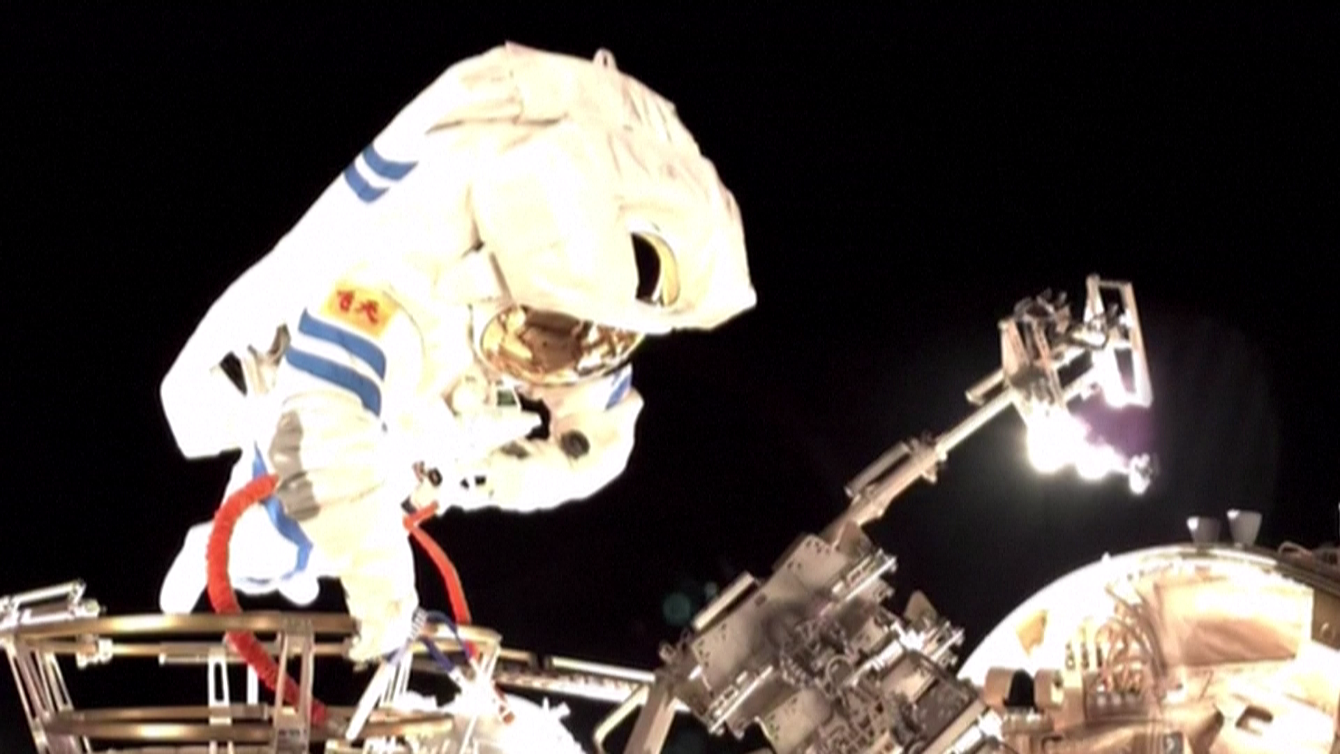 Astronauts from the Shenzhou-21 mission conduct a spacewalk outside the Chinese space station, December 9, 2025. /China Manned Space Agency