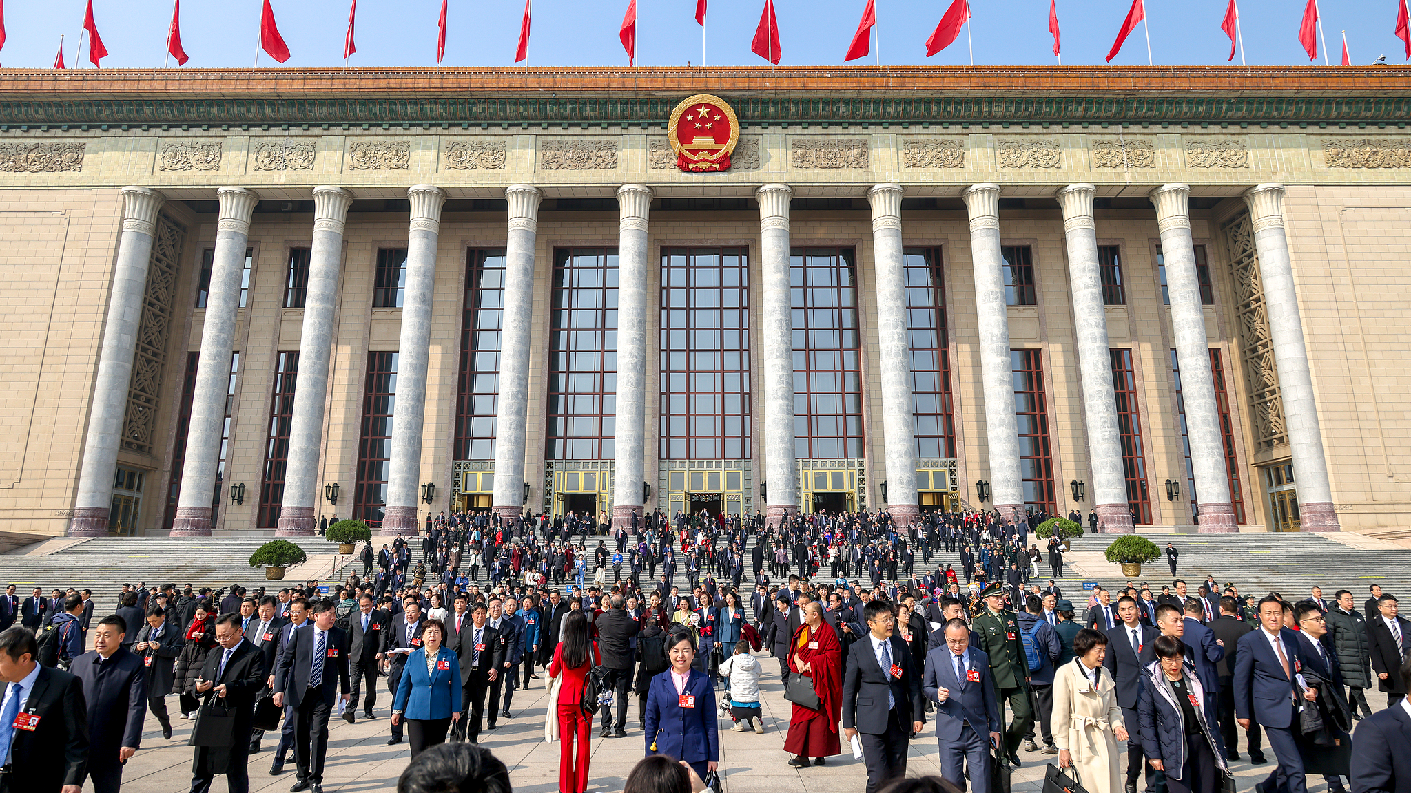 Deputies to the 14th National People's Congress walk out of the Great Hall of the People after the second plenary meeting of the third session of the 14th NPC in Beijing, China, March 8, 2025. /VCG