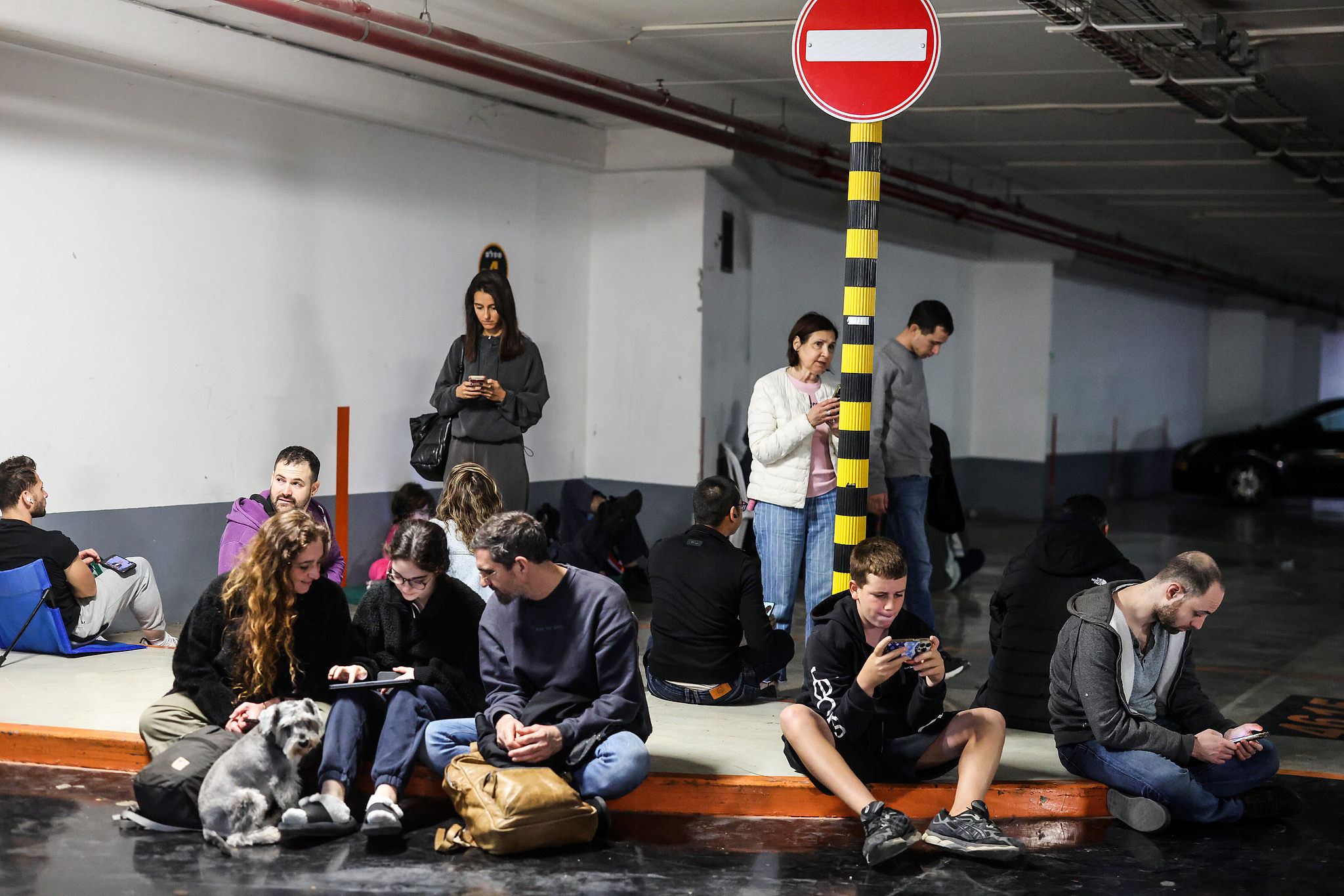 People take shelter in an underground parking lot following alarms for incoming missiles from Iran in Tel Aviv, Israel, February 28, 2026. /VCG