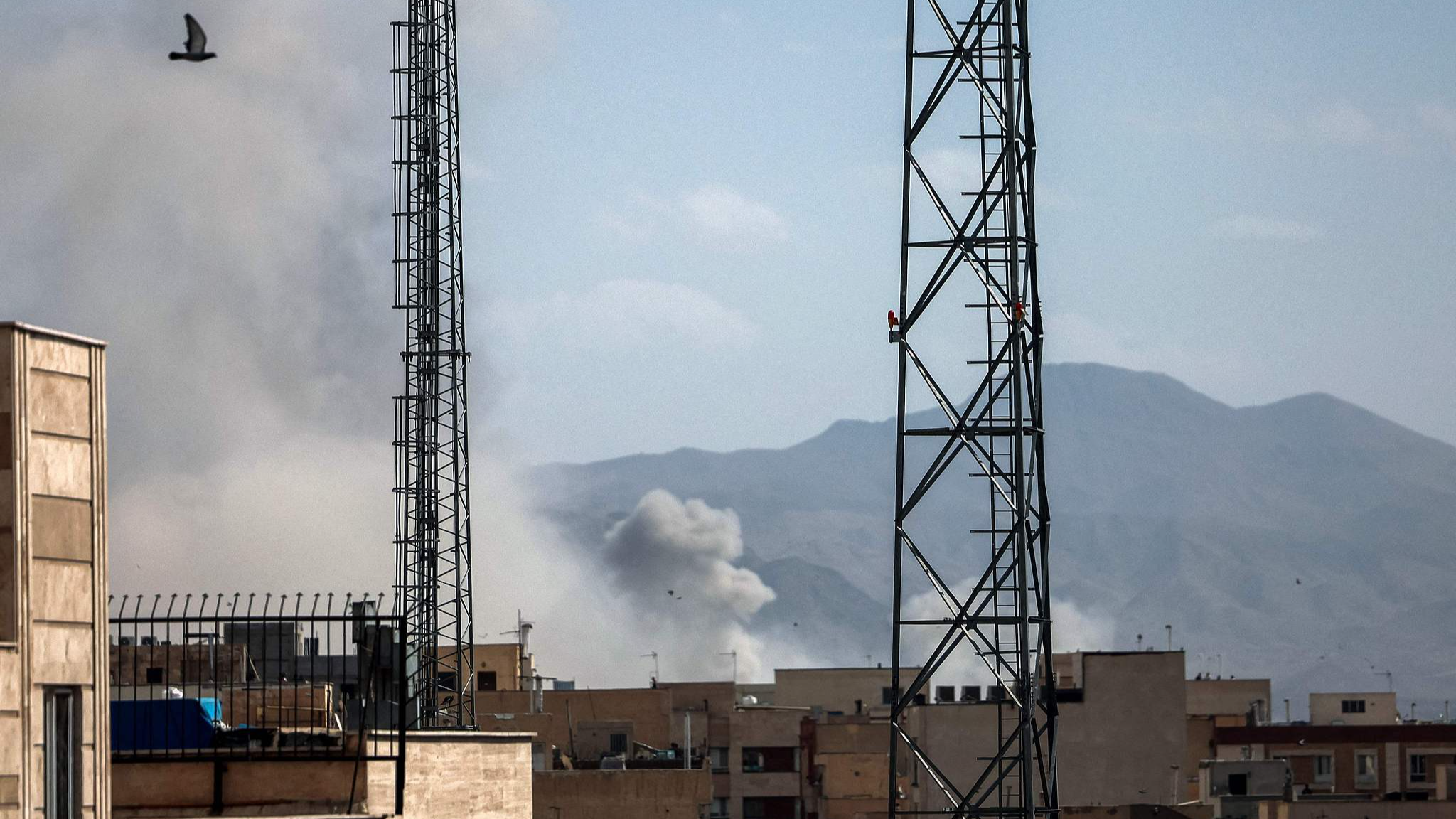 A plume of smoke rises following a reported explosion in Tehran, Iran on February 28, 2026. /VCG