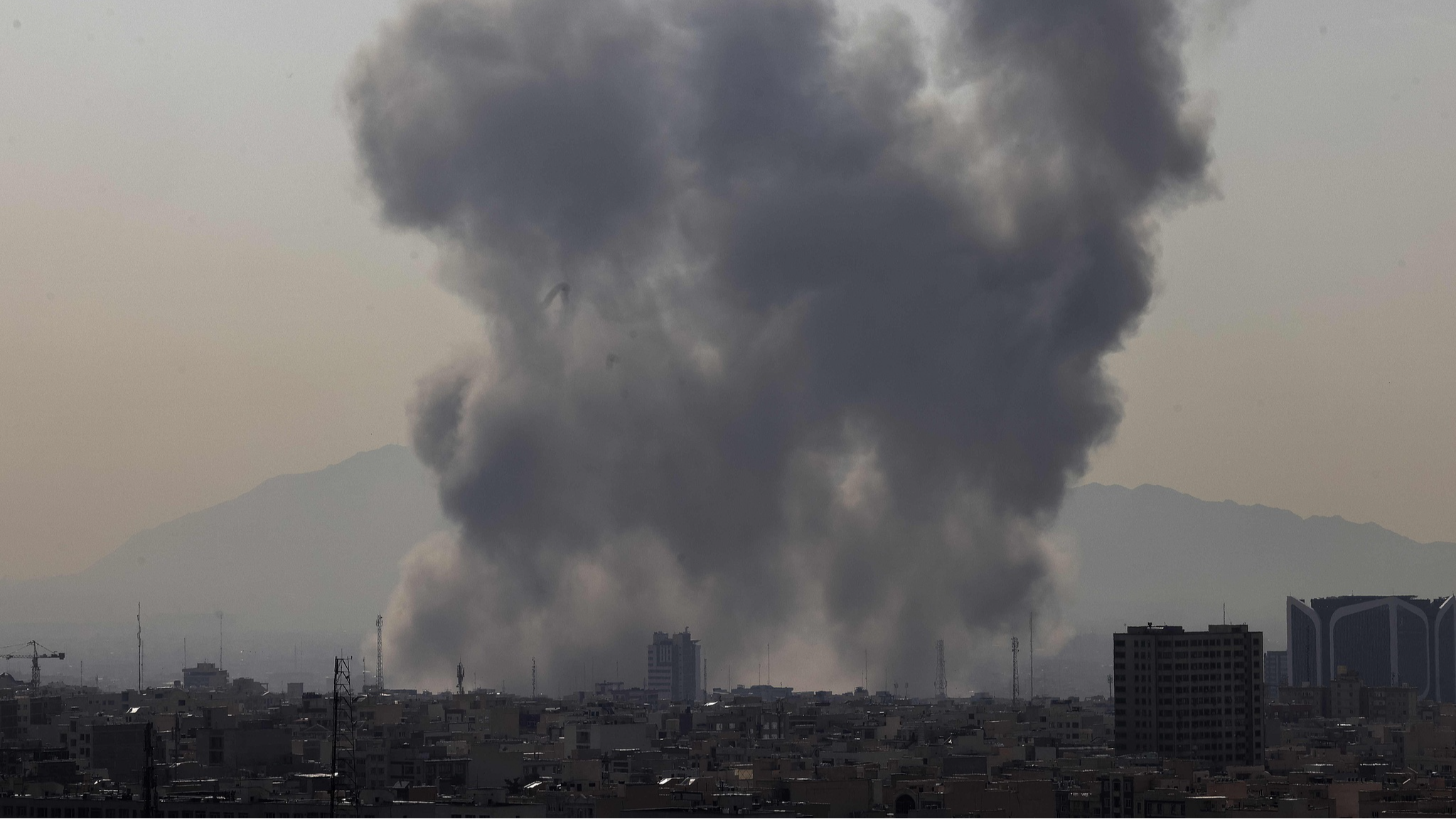 A plume of smoke rises following a reported explosion in Tehran on February 28, 2026. /VCG