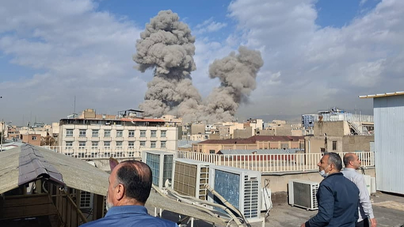 People watch as smoke rises on the skyline after an explosion in Tehran, Iran, Saturday, February 28, 2026. /VCG