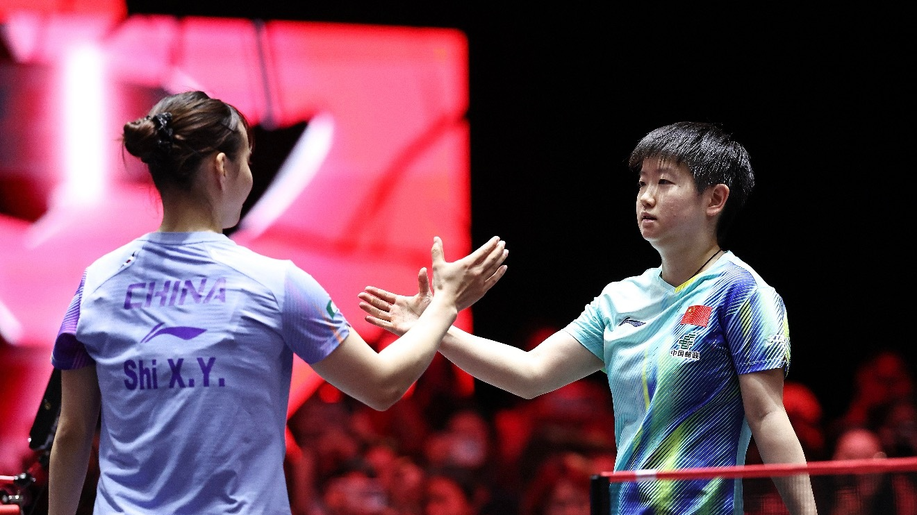 Sun Yignsha (R) and Shi Xunyao of China shake hands after their women's singles round of 16 match at the WTT (World Table Tennis) Singapore Smash in Singapore, February 27, 2026. /WTT