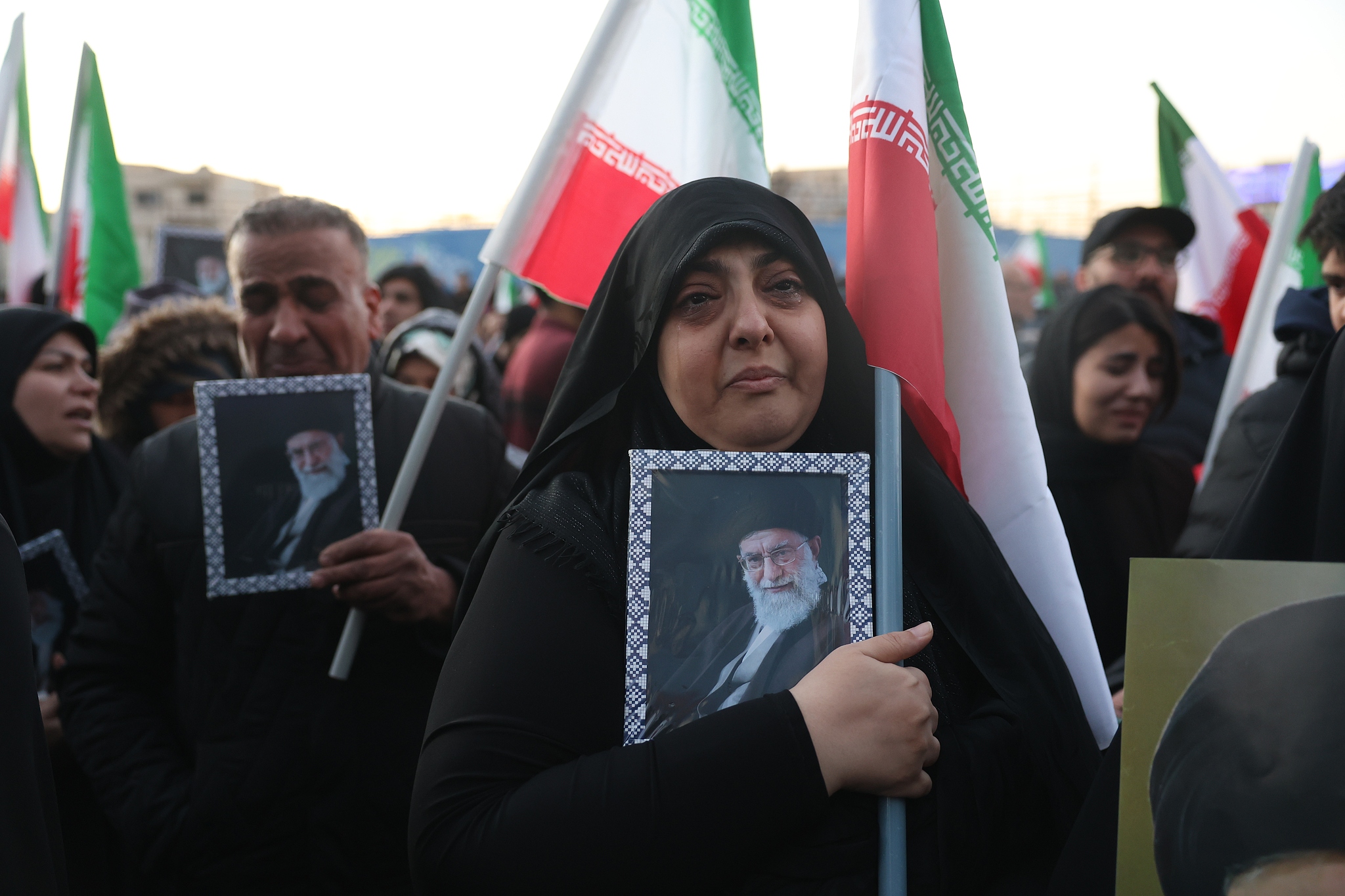 Mourners hold pictures of Iranian Supreme Leader Ayatollah Ali Khamenei at Enqelab Square in Tehran, Iran, March 1, 2026. /CFP