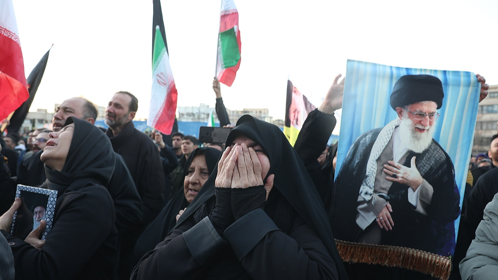 Mourners react following the death of Iranian Supreme Leader Ayatollah Ali Khamenei, at Enqelab Square in Tehran, Iran, March 1, 2026.