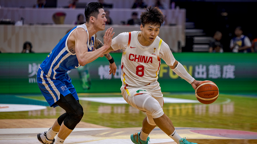Zhao Rui (Right) of China dribbles against Chinese Taipei in an Asian Group B game in 2027 FIBA World Cup Qualifying at the Mall of Asia Arena in Manila, Philippines, March 1, 2026. /CFP