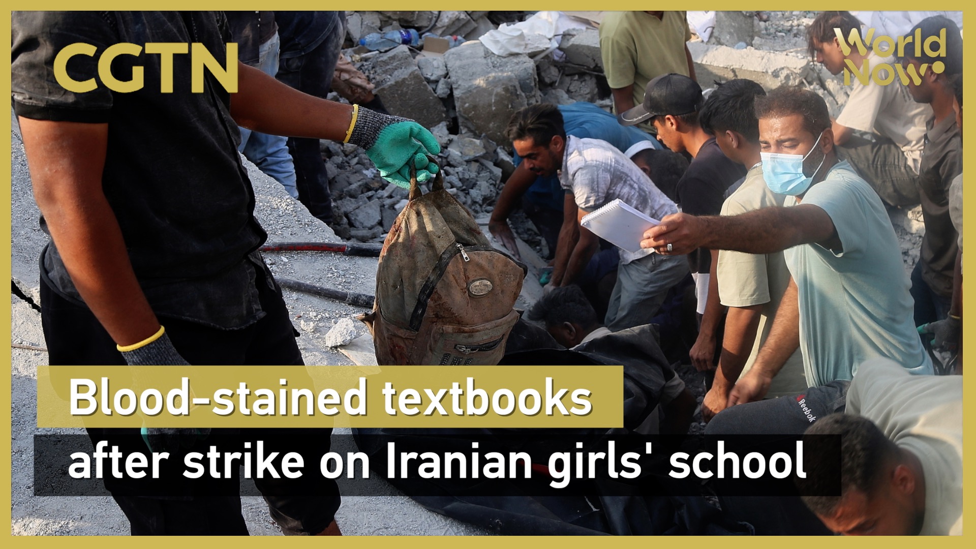 Blood-stained textbooks after strike on Iranian girls' school