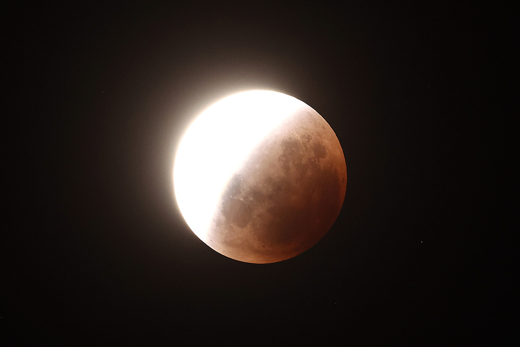 The moon orbits through the Earth's shadow resulting in a lunar eclipse, Auckland, New Zealand, March 3, 2026. /VCG