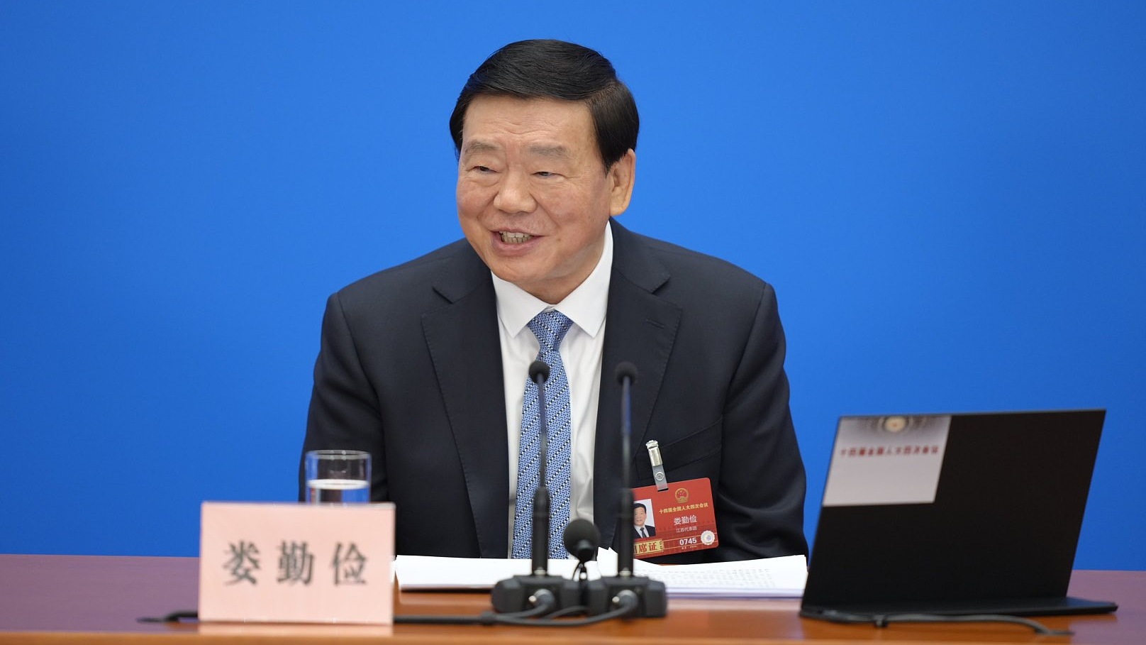 Lou Qinjian, spokesperson for the fourth session of the 14th National People's Congress, answers questions at the press conference, March 4, 2026. /VCG