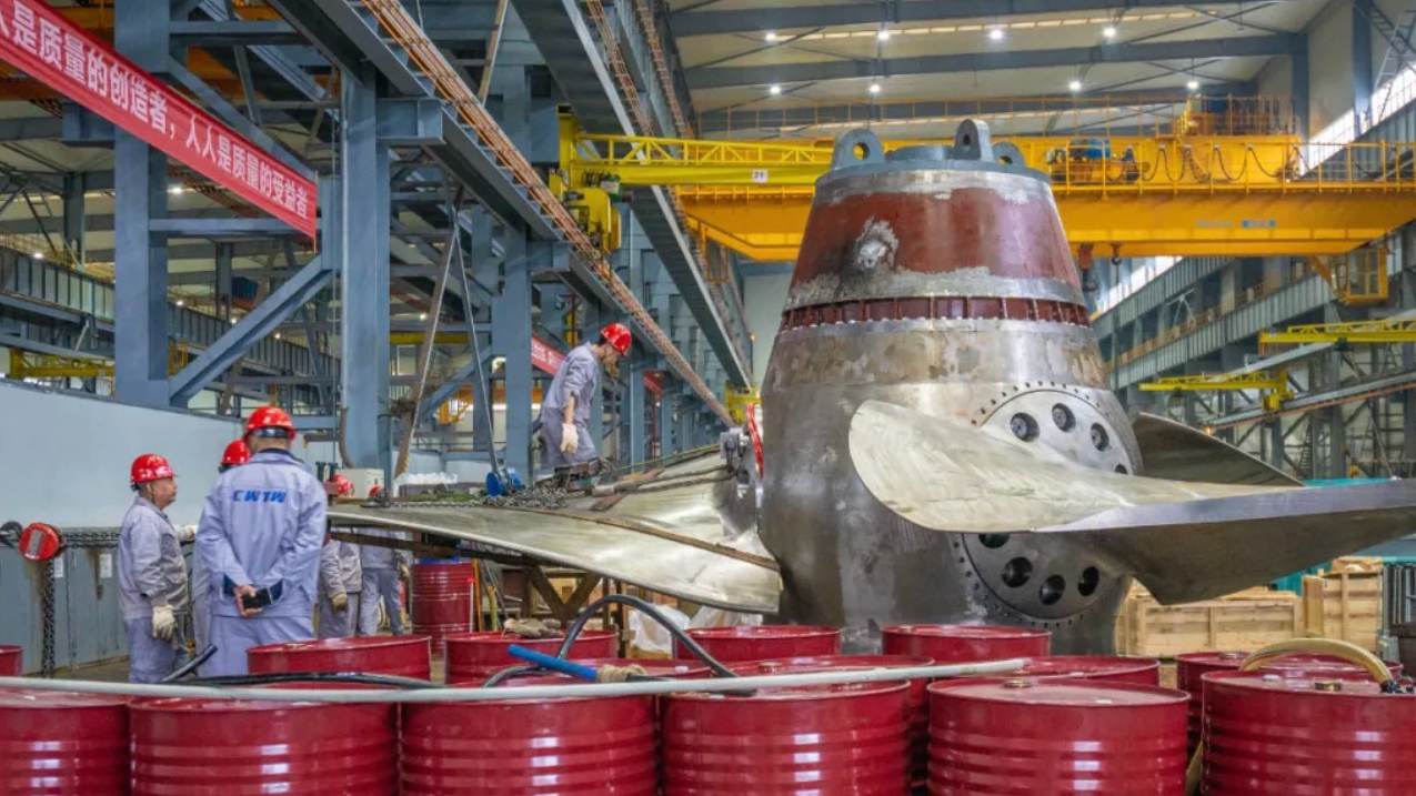 Workers assemble a turbine runner at the production base of Chongqing Water Turbine Works Co., Ltd. /Chongqing Water Turbine Works Co., Ltd