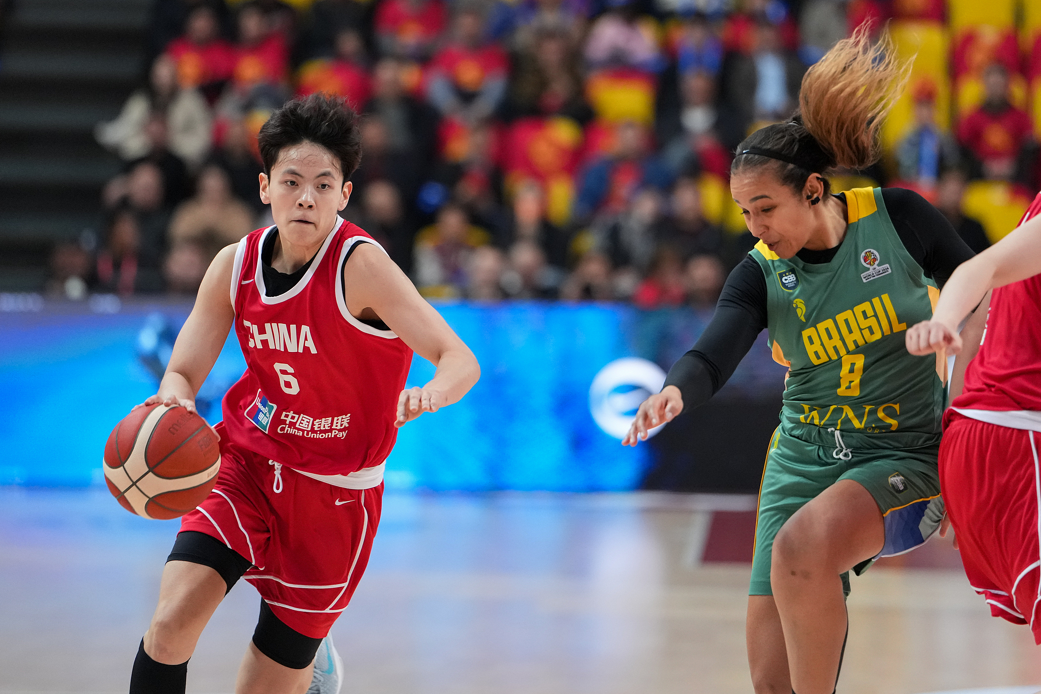 China Yang Shuyu (L) in action during their women's basketball friendly clash with Brazil in Changsha, China, March 4, 2026. /VCG