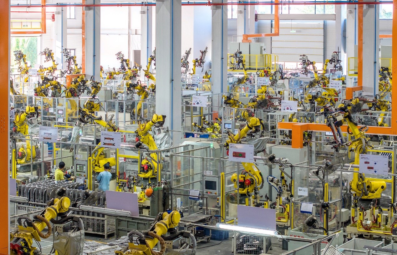 Fully automated robots run at high speed as workers manufacture stamped body components and axle products for NEVs in Huzhou, Zhejiang Province, China, October 9, 2025. /VCG