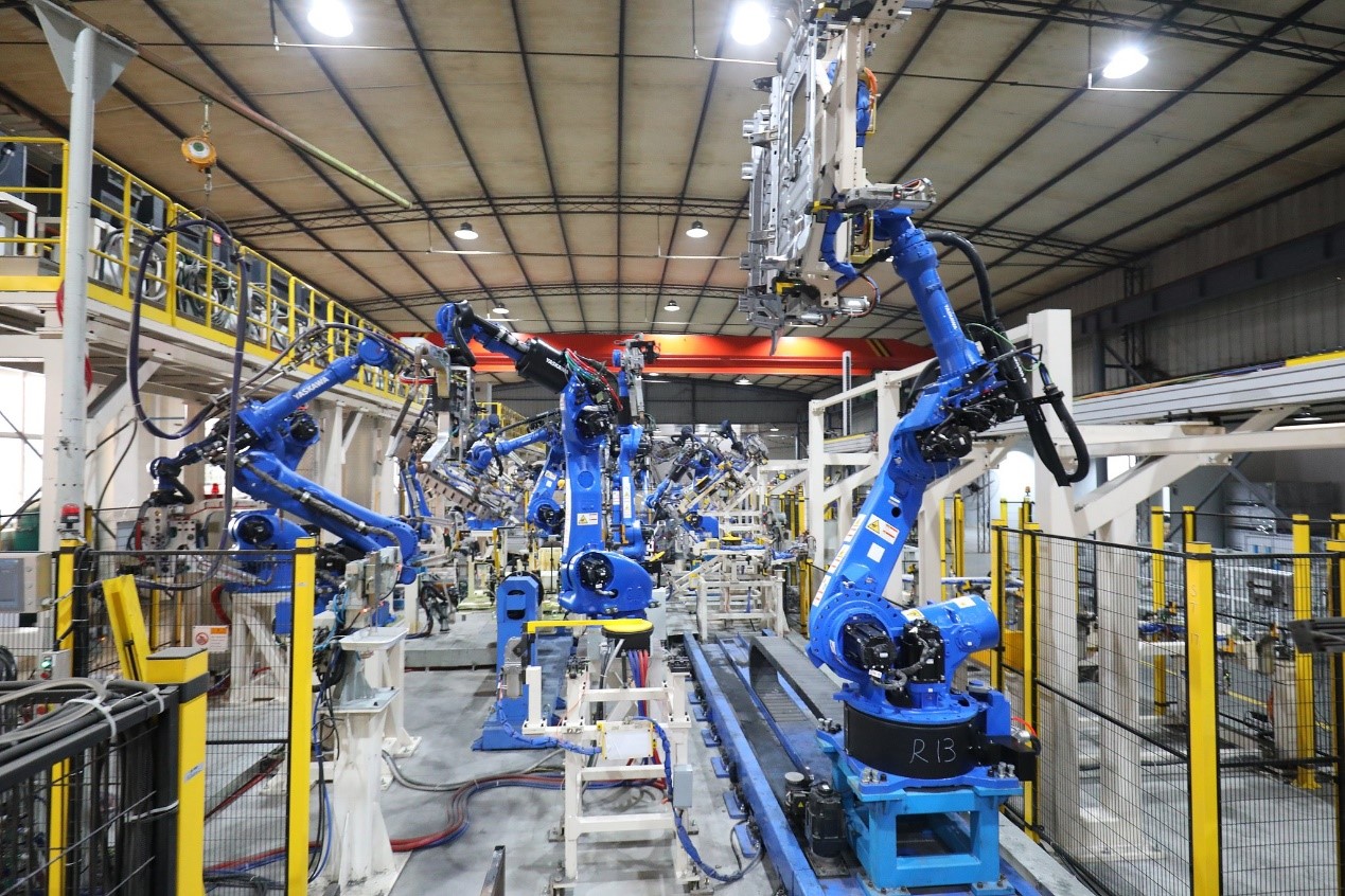 Robotic arms run on an intelligent sheet metal component production line for NEVs at Chongqing Shunlan Machinery Manufacturing Co., Ltd., China, February 24, 2026. /VCG