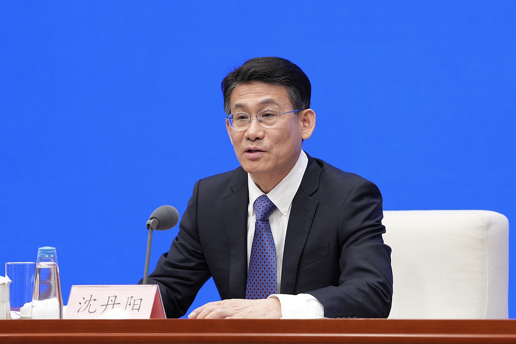 Shen Danyang, head of the drafting team for the Government Work Report answering questions from reporters at a press briefing held by the State Council Information Office in Beijing, China, March 5, 2026./ VCG