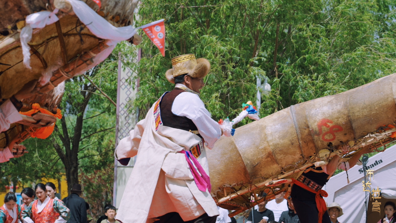 Performers stage the bullhide boat dance, known as 