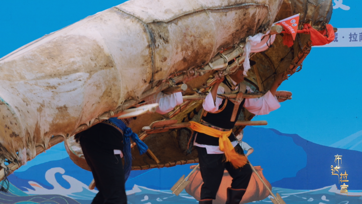 Performers stage the bullhide boat dance, known as 