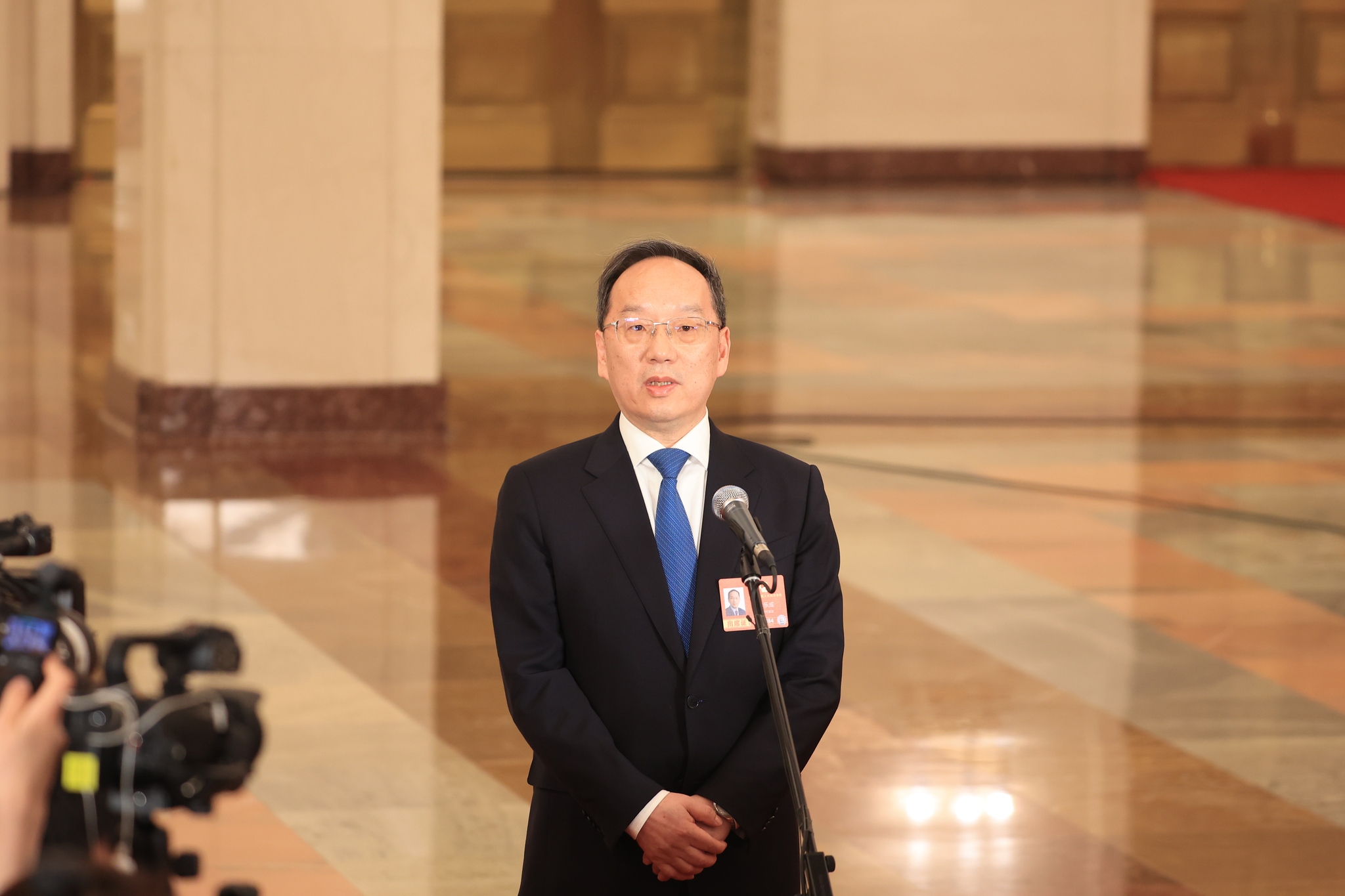 Li Lecheng, China's minister of Industry and Information Technology, participates in an open interview, in Beijing, China, on March 5, 2026. /VCG