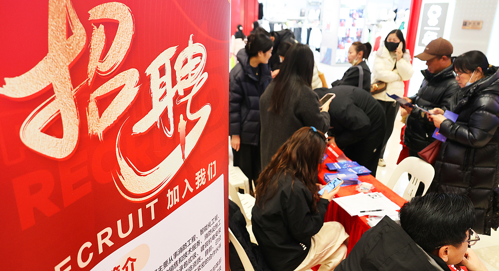 Job seekers consult recruiters about available positions at a recruitment event in Lianyungang City, east China's Jiangsu Province, March 3, 2026. /VCG