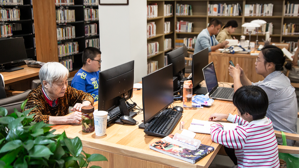 Residents of different ages enjoy their holidays at a local bookstore in Fuzhou, Fujian Province on October 4, 2024. /VCG