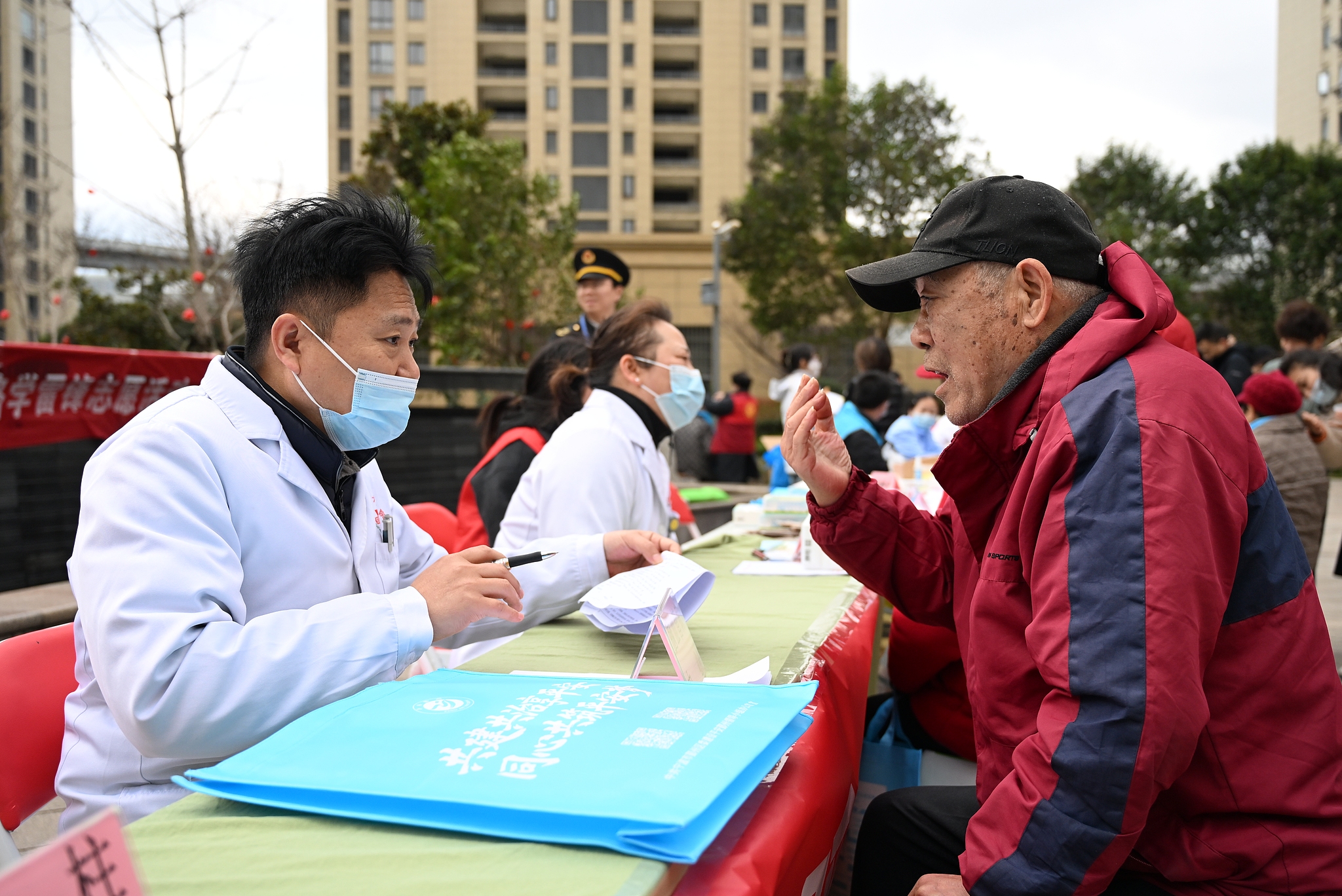 A doctor examines an elder at a free medical consultation event in Ningbo City, east China's Zhejiang Province, March 5, 2026. /VCG