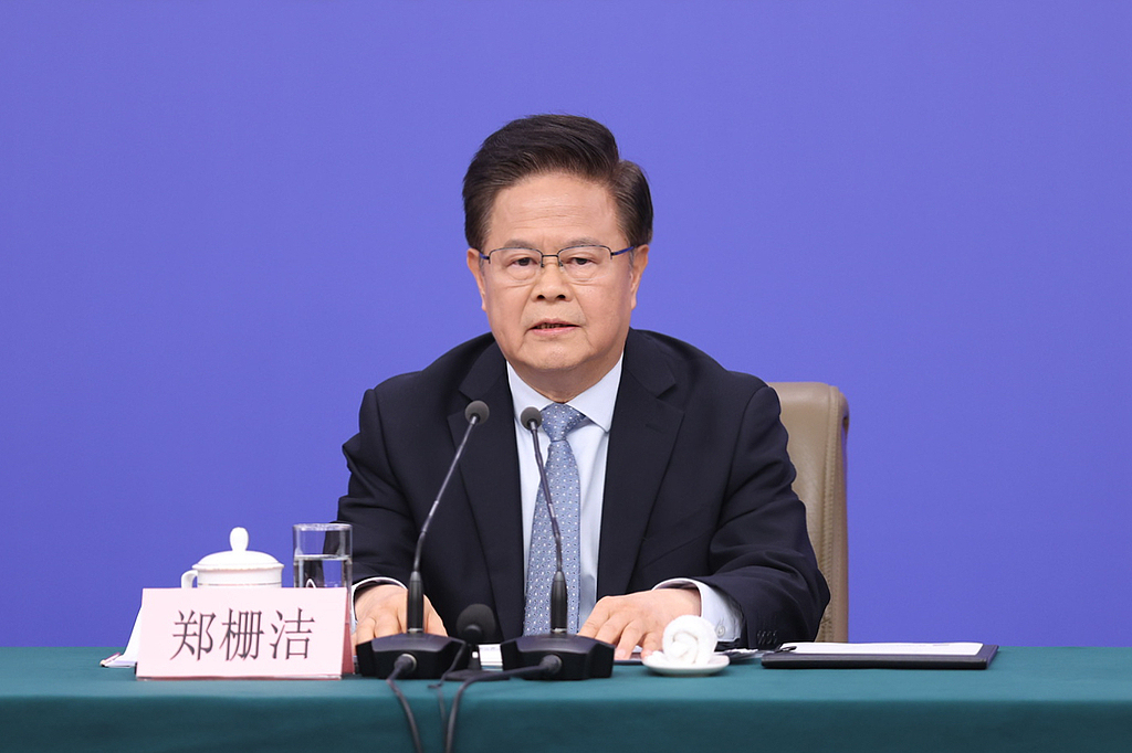 Zheng Shanjie, head of the National Development and Reform Commission (NDRC), answers questions at the Media Center in Beijing, China, March 6, 2026. /VCG