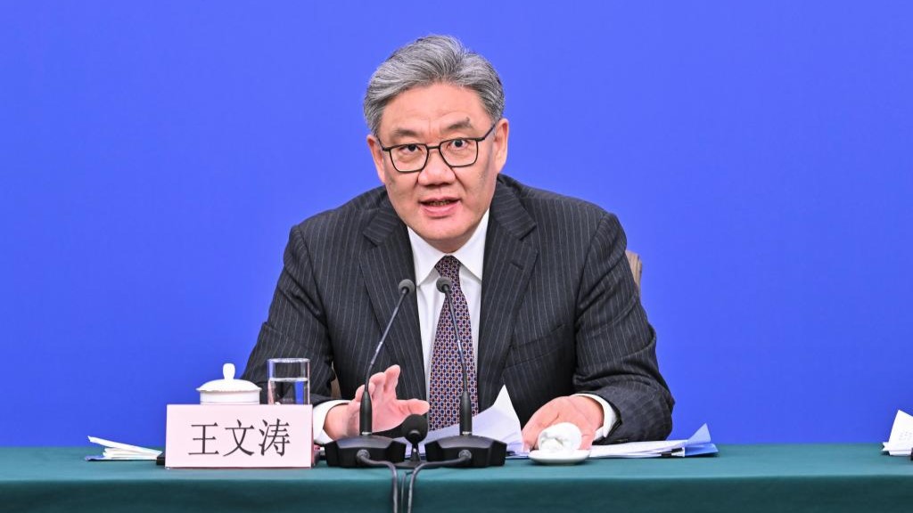 Minister of Commerce Wang Wentao talks with media reporters about China's plan to boost domestic consumption during a press conference of the fourth session of the 14th National People's Congress, Beijing, China, March 6, 2026. /Xinhua