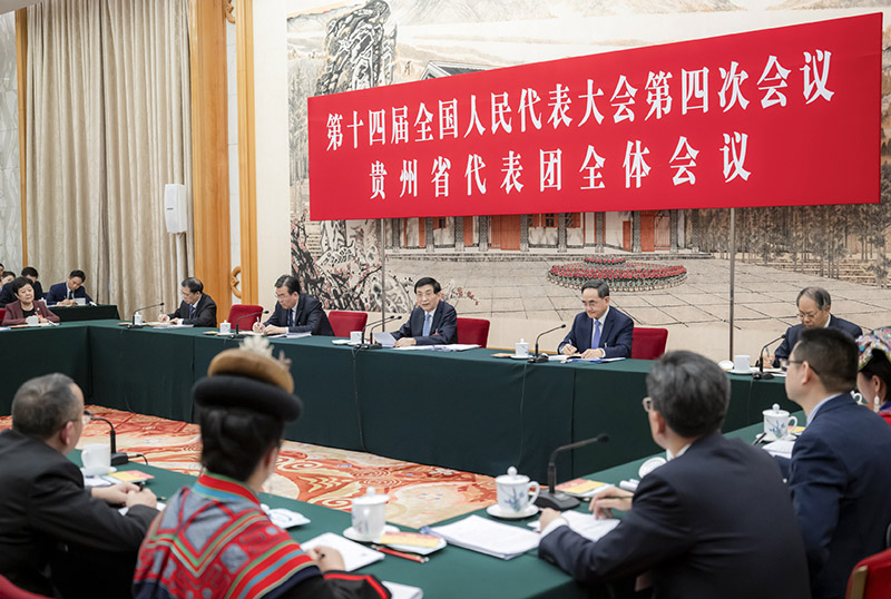 Wang Huning, a member of the Standing Committee of the Political Bureau of the Communist Party of China Central Committee and chairman of the Chinese People's Political Consultative Conference National Committee, joins deputies from the delegation of Guizhou Province to deliberate on the government work report at the fourth session of the 14th National People's Congress in Beijing, capital of China, March 5, 2026. /Xinhua