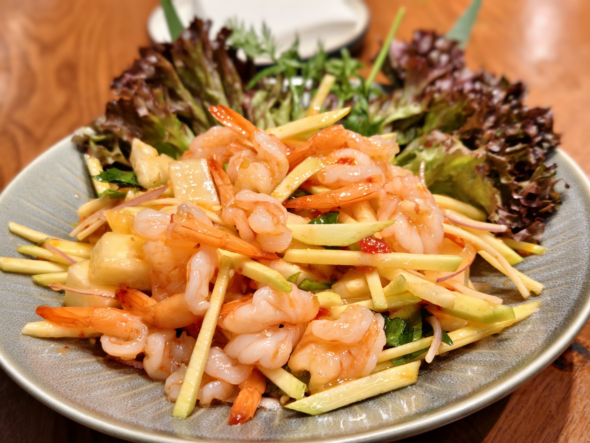 A shrimp and mango dish is pictured at a restaurant in Kunming, Yunnan Province on February 24, 2026. /VCG
