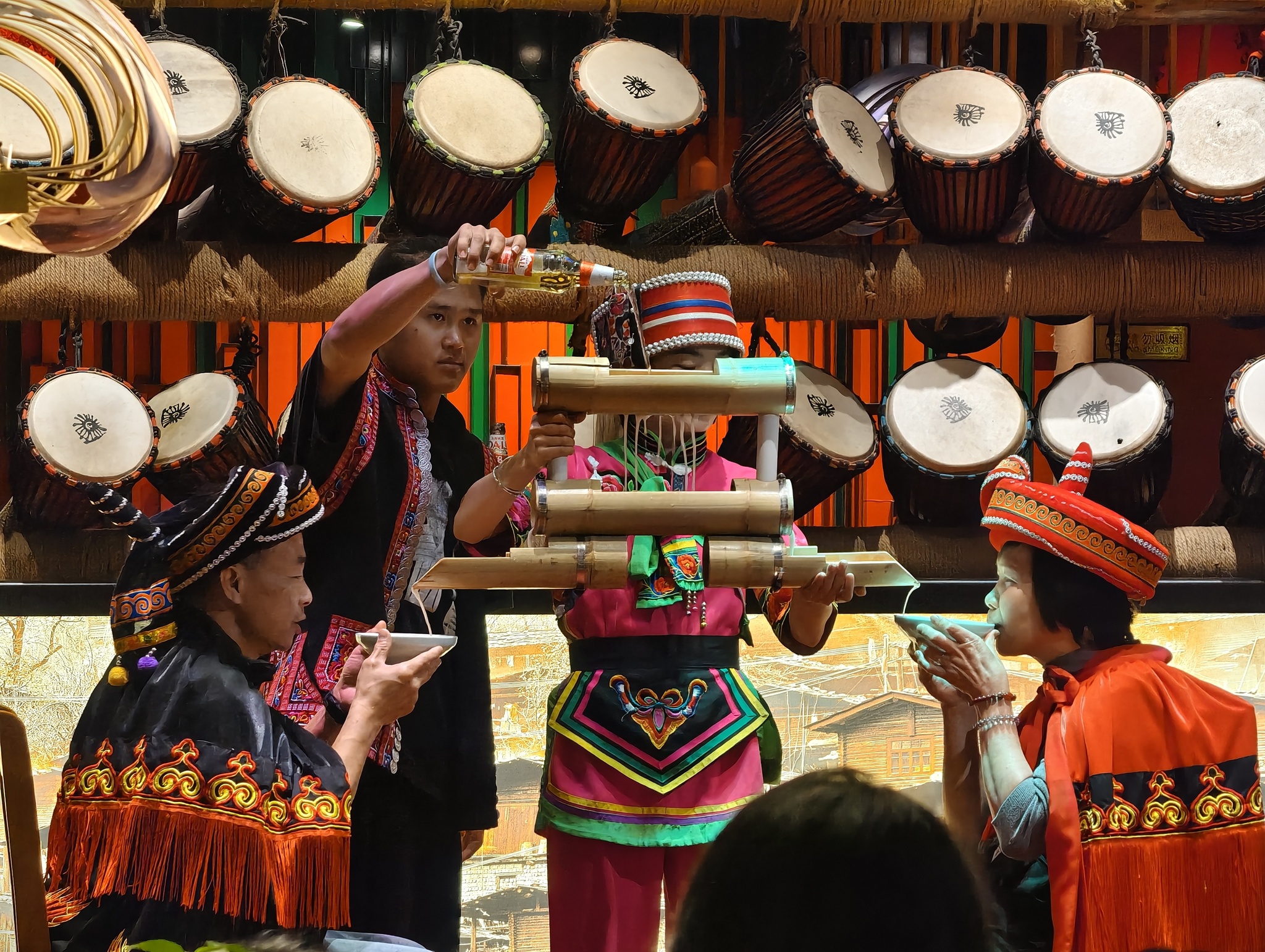 A lively toasting ritual is performed for diners at a restaurant in Kunming, Yunnan Province on February 24, 2026. /VCG