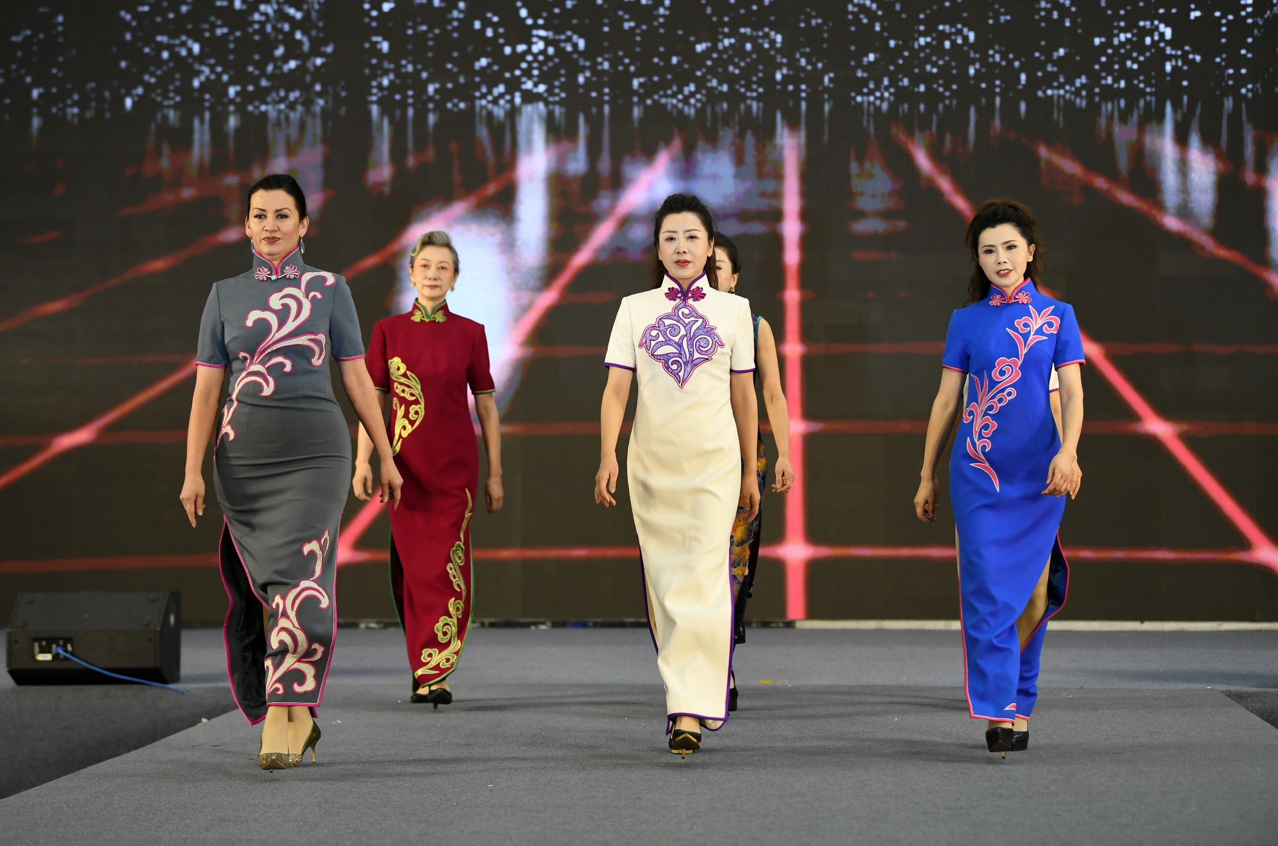 Senior models showcase traditional Chinese attire in Urumqi, Xinjiang on February 8, 2026. /IC